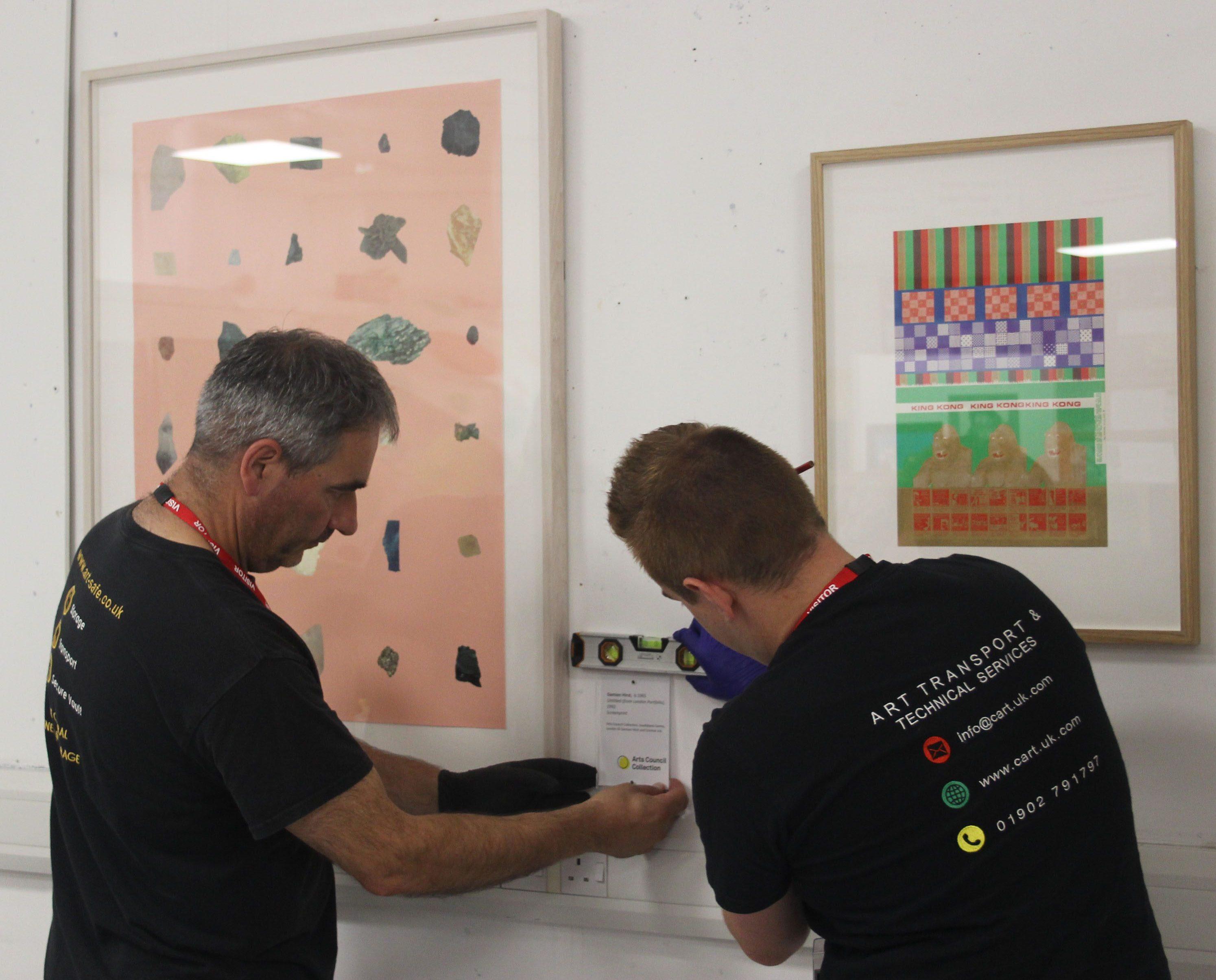 Arts Council installing the exhibition